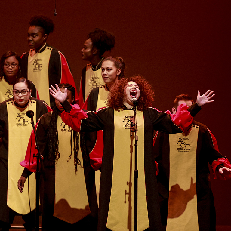 African American Choral Ensemble vocalist performing on stage