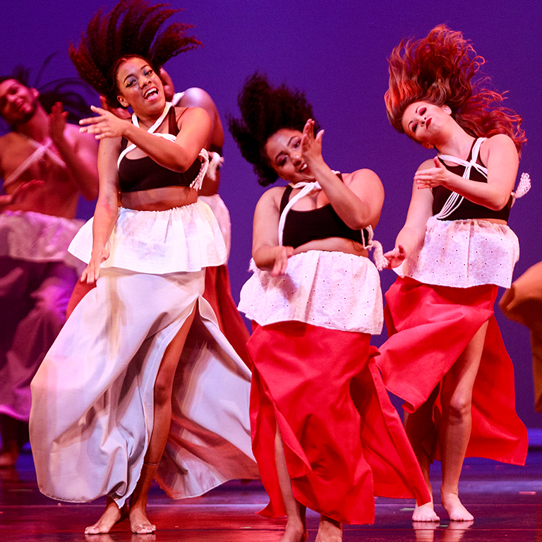 Dancers onstage with the African American Dance Company