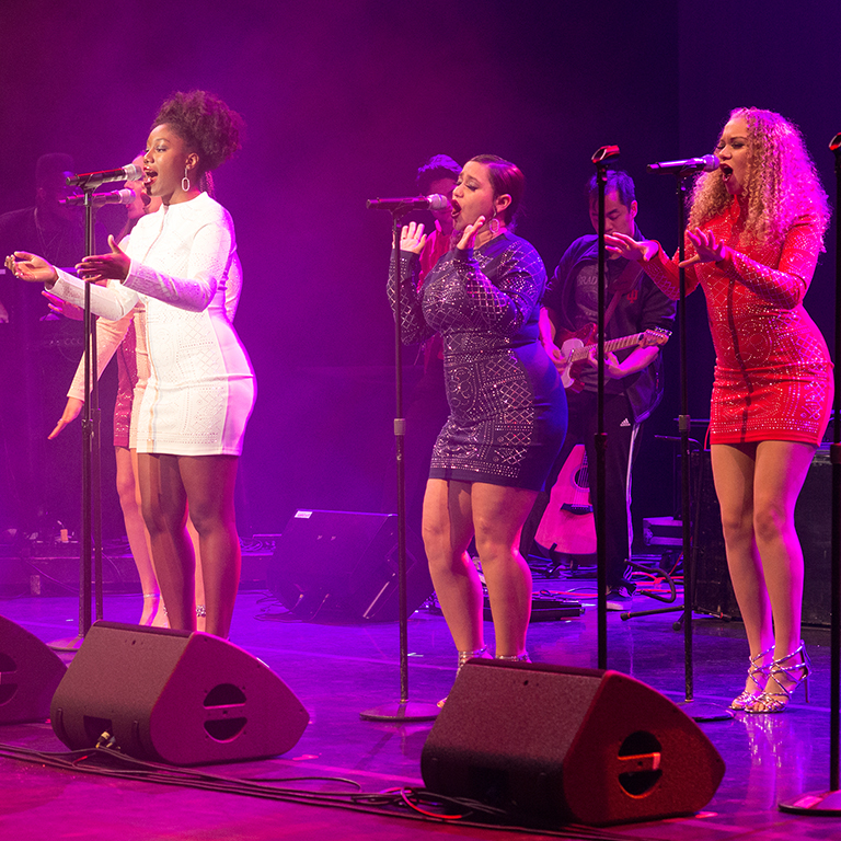 A group of female singers performs with the IU Soul Revue
